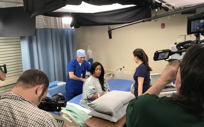 nurse conducting medical procedures on patient